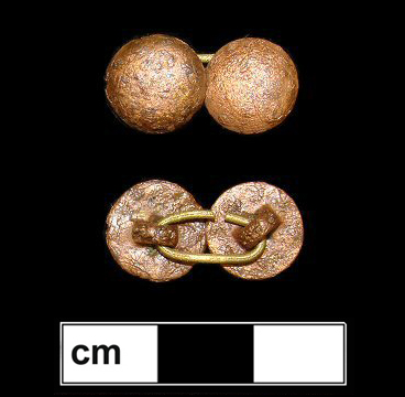 Plain domed copper alloy buttons with a copper alloy link. The alloys of the buttons and link appear to have different amounts of copper since the color is very different after chemical stripping.